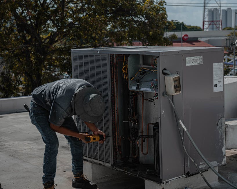 Expert HVAC technician performing professional new air conditioning system installation