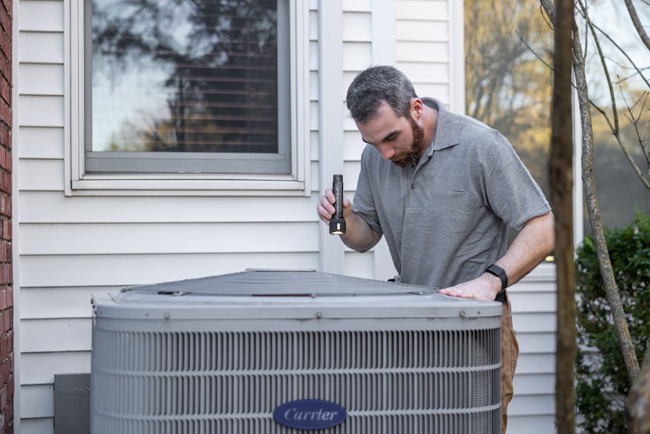 Certified technician performing comprehensive annual HVAC maintenance and system tune-up